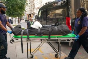 PHOTO Of Gustavo Arnal's Body Being Taken Away From Scene Of Fall In Body Bag