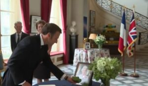 PHOTO President Macron Of France Left A Single White Rose Next To Portrait Of Queen Elizabeth At British Embassy In Paris