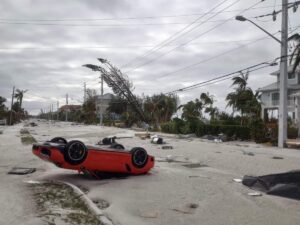 PHOTO Brand New Porsche Flipped Upside Down On Estero Blvd Which Is Now A Ghost Town In Fort Myers Beach Florida