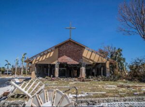 PHOTO Church Badly Damaged By Main Building Still Standing With Cross On Top In Fort Myers Beach