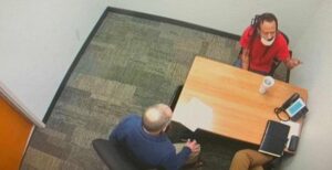 PHOTO Darrell Brooks Throwing Up Gang Signs While In Conference Room In Court