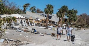 PHOTO Homeowners Who Survived Hurricane Ian While Staying In Fort Myers Beach Carrying Everything They Own In Suitcases To Safety Where They Can Survive