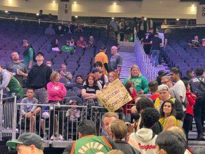 PHOTO Seattle Sonics Fans At Climate Pledge Arena Holding Sign That Says All We Want For Our Birthday Is The Sonics Back
