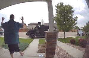 PHOTO Anderson Lee Aldrich Putting His Hands Up In Surrender As SWAT Closes In On Him