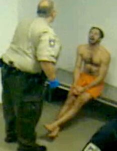 PHOTO John Tyson Yelling At Security Guard While Shirtless In Jail Holding Cell