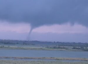 PHOTO Of Cars Driving On Bridge As Tornado Spins Over Mobile Bay In Mobile Alabama