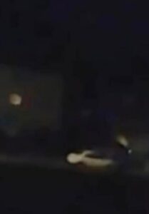 PHOTO Body Cam Footage Of White Car Driving Away From Kaylee Goncalves House Without Headlights On