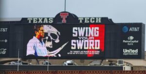 PHOTO Jones AT&T Stadium Honoring Mike Leach With Swing Your Sword Graphic On Videoboard