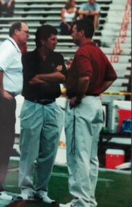 PHOTO Mike Leach Talking On The Sideline To Bob Stoops When He Was The Offensive Coordinator At OU