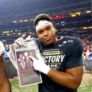 PHOTO Devin Willock Holding Up Newspaper After Georgia Won National Title