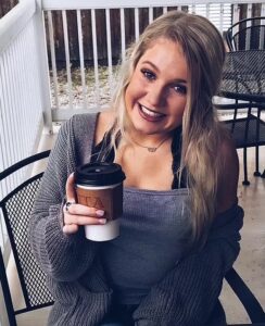 PHOTO Madison Brooks Drinking Coffee On A Patio