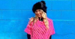 PHOTO Madison Brooks In Furry Hat And Bright Pink Shirt