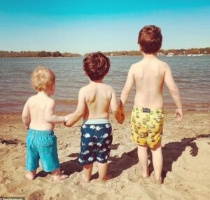 PHOTO Of Ana Walshe's Three Young Kids Holding Hands On The Beach