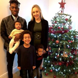 PHOTO Christian Atsu In Front Of The Christmas Tree With His Family In December