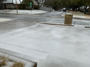 PHOTO Of 3 Inches Of Brick Solid Ice On Resident's Driveways Inside 635 Freeway In NE Dallas TX