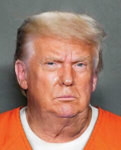 PHOTO Donald Trump Wearing A T-Shirt Under His Orange Prison Jumpsuit To Support His Chest