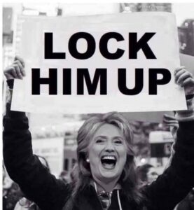 PHOTO Hillary Cinton Holding Lock Him Up Sign For Donald Trump Meme