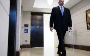 PHOTO John Fetterman Walking Around Hospital With A Bottle Of Water