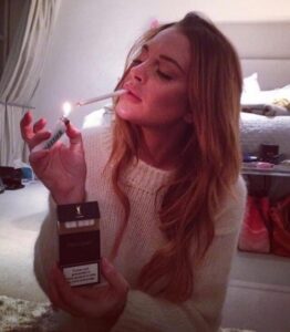 PHOTO Lindsay Lohan Lighting A Cigarette In Her Bedroom