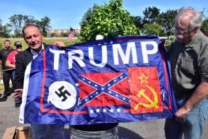 PHOTO MAGA Supporters Holding Trump Flag With Nazi Symbol On It