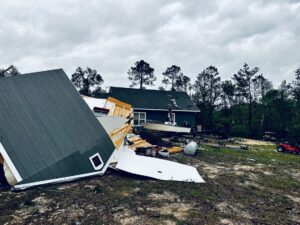 PHOTO Mobile Home Flipped Upside Down And Walls Caved In After Tornado In Hosford Florida