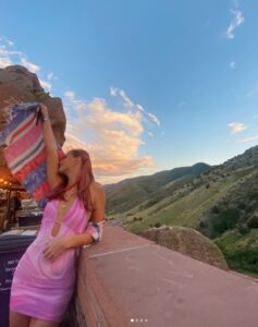 PHOTO Will Levis' Sister Showing Out In Bright Pink And Purple Dress At Red Rocks In Denver