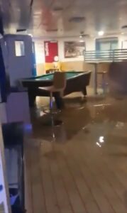 PHOTO Dining Area On Carnival Cruise Ship Flooded With Water And It Looks So Depressing For The Travelers
