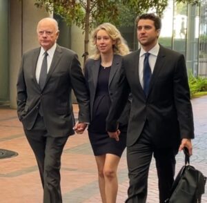 PHOTO Elizabeth Holmes Leaving Court Pregnant And Holding Hands With Her Team