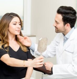 PHOTO Khazar Momeni's Husband Touching Her Chin While He's Dressed Up In Medical Gear