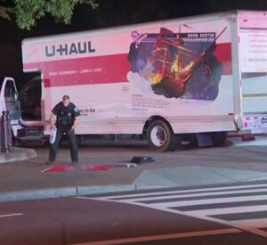 PHOTO Police Officer Putting Sai Varshith Kandula's Nazi Flag On The Ground After Searching His U-Haul