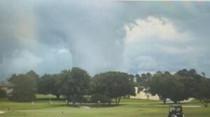 PHOTO Still Shot Of Tornado Touching Down Behind Golf Course In Conroe Texas