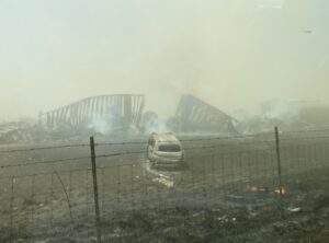 PHOTO Wrecked Car And Damaged Fencing Lay On The Side Of The I-55 Highway In Illinois From Dust Storm