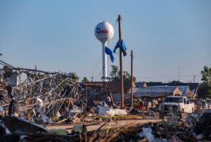 PHOTO Tornado Destruction All Around With City Of Perryton Flag In The Background