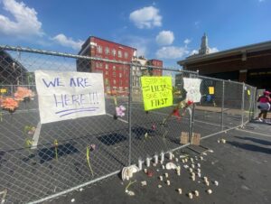 PHOTO Protesters Signs Protesting Andrew Wold Outside Davenport Apartment Building