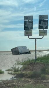 PHOTO Semi-Truck Flips Over Trying To Drive Through A Foot Of Rain In O’Donnell Texas