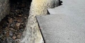 PHOTO Close Up Of Cracked Road In West Point New York Due To Flooding