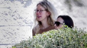PHOTO Elizabeth Holmes Peaking Through The Bushes While In Minimum Security Prison