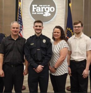 PHOTO Jake Wallin With His Parents And Brother When He Was Sworn In As An Officer