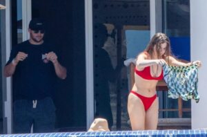 PHOTO Josh Allen Fist Pumping While Hailee Steinfeld Is Shaking Out Josh's Swimming Trunks On A Balcony