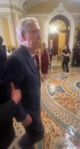 PHOTO Mitch McConnell Being Pulled Away From Podium And He Had No Idea Why
