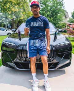 PHOTO YNG Cheese Posing For A Picture With $100K Sports Car
