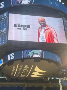 PHOTO DJ Casper Shown On Jumptron At Sky WNBA Game 1965-2023 RIP