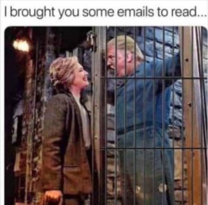 PHOTO Hillary Clinton Bringing Trump Emails To Read In Prison