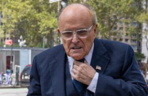 PHOTO Rudy Giuliani Fixing His Tie Before Going Into Court