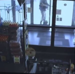 PHOTO Ryan Palmeter Opening Dollar Store Door While Holding Loaded AR-15 Automatic Gun