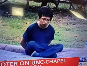 PHOTO You Could Have Thought Tailei Qi Sitting On Curb In Custody Was A Deepfake Because It Looked Like It
