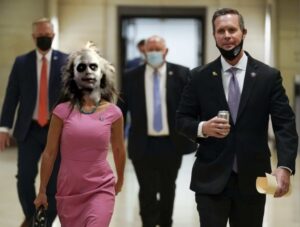 PHOTO Lauren Boebert Wearing A Halloween Mask While Being Escorted Out Of The Capitol Meme