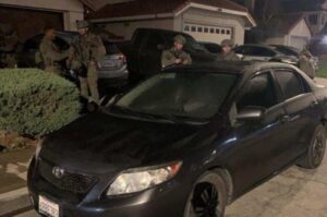 PHOTO SWAT Raiding Kevin Salazar's House With His Toyota Corolla Parked Out Front
