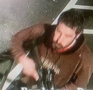 PHOTO Close Up Of Robert Card Looking At Himself On Surveillance Camera While Holding Gun