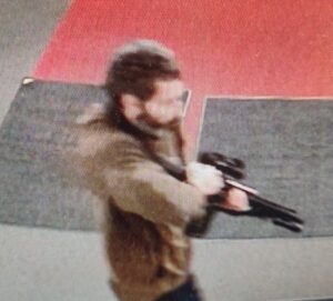 PHOTO Robert Card Loading His Gun In Hallway Before Shooting